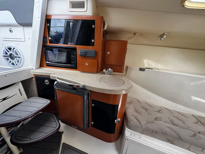  Yacht Photos Pics 2005 Hydra-Sports 3300 VX cabin interior with kitchenette and seating area.