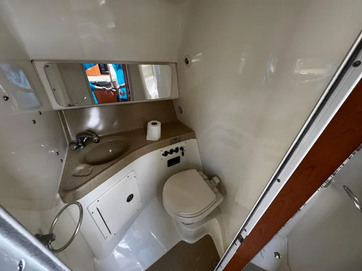  Yacht Photos Pics 2005 Hydra-Sports 3300 VX boat bathroom with sink, toilet, and mirror.