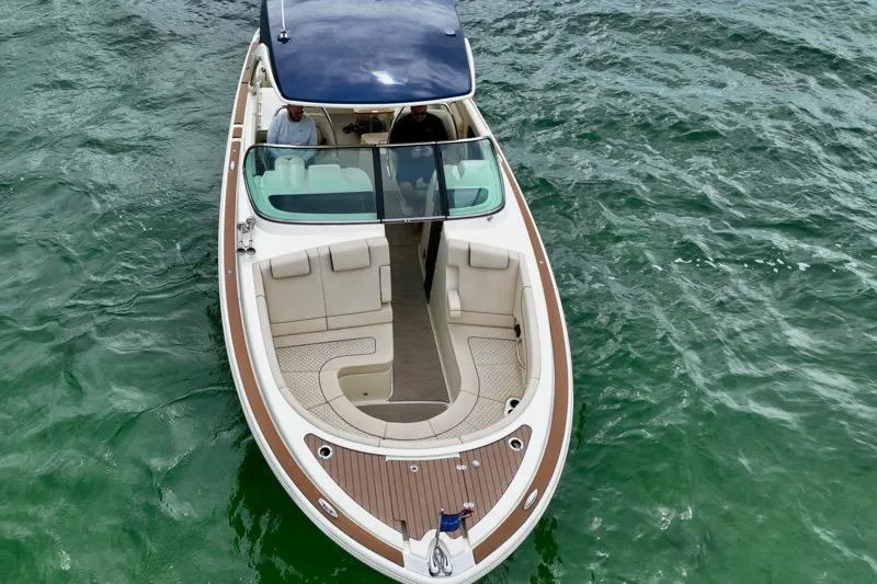 Twin Tides Yacht Photos Pics 2024 Chris-Craft Launch 35 GT boat on water, aerial view.