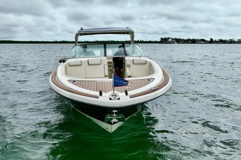 Twin Tides Yacht Photos Pics 2024 Chris-Craft Launch 35 GT boat on water, showcasing elegant design and luxury features.