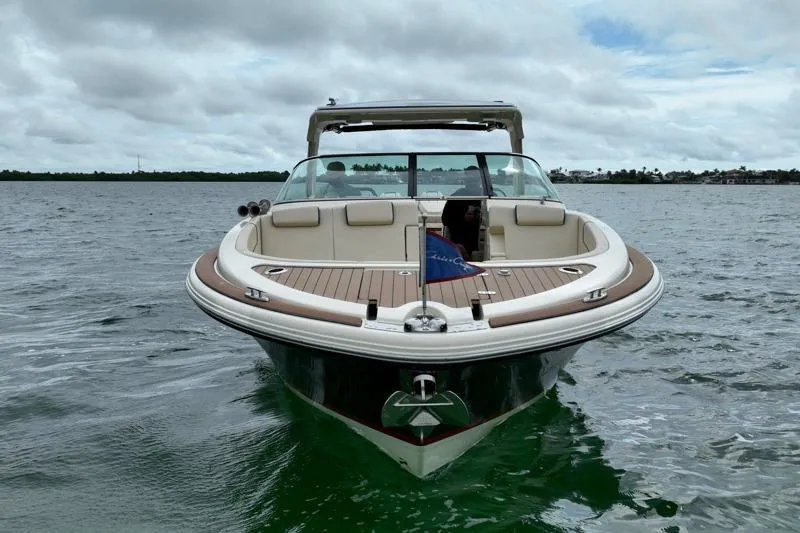 Twin Tides Yacht Photos Pics 2024 Chris-Craft Launch 35 GT boat on water, showcasing elegant design and luxury features.