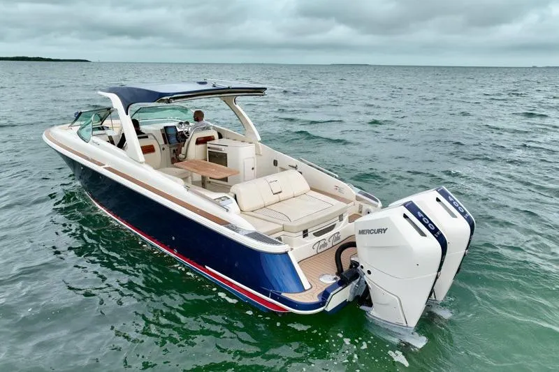 Twin Tides Yacht Photos Pics 2024 Chris-Craft Launch 35 GT boat on open water, featuring sleek design and powerful Mercury engines.