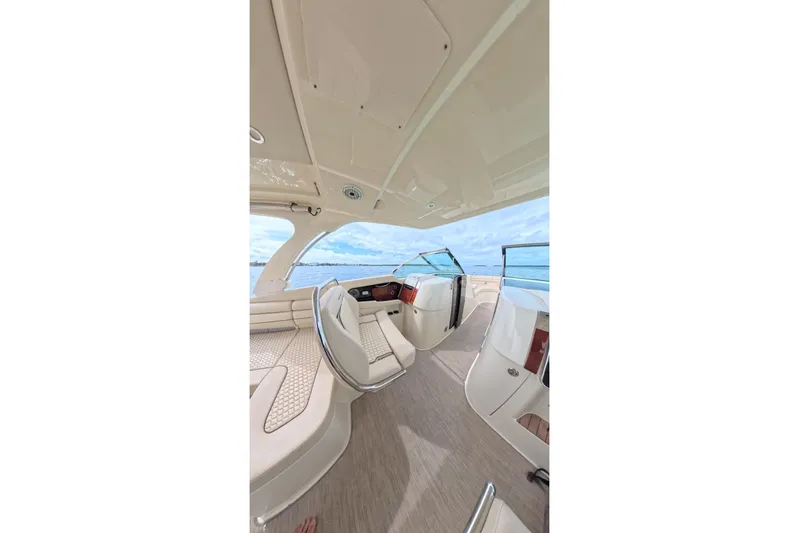 Twin Tides Yacht Photos Pics Luxurious interior of 2024 Chris-Craft Launch 35 GT boat with elegant seating and ocean view.