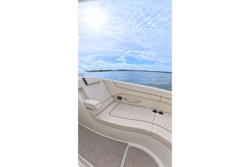 Twin Tides Yacht Photos Pics 2024 Chris-Craft Launch 35 GT boat interior with beige seating and ocean view.