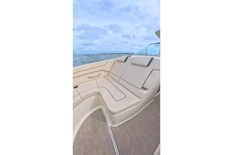 Twin Tides Yacht Photos Pics 2024 Chris-Craft Launch 35 GT boat interior with beige seating and ocean view.