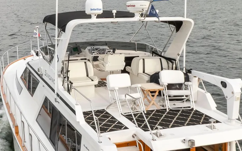  Yacht Photos Pics 1989 Ocean Alexander 50 Sedan yacht with spacious deck and seating, cruising on water.