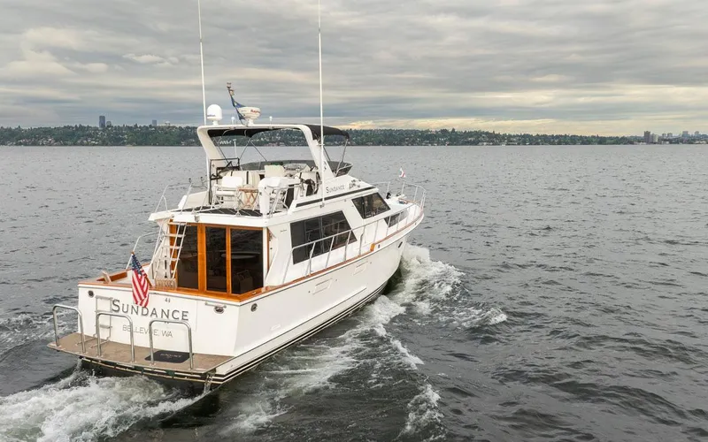  Yacht Photos Pics 1989 Ocean Alexander 50 Sedan yacht cruising on a cloudy day.