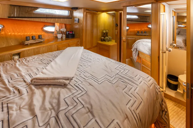  Yacht Photos Pics Luxurious cabin interior of 1989 Ocean Alexander 50 Sedan yacht with cozy bedding.