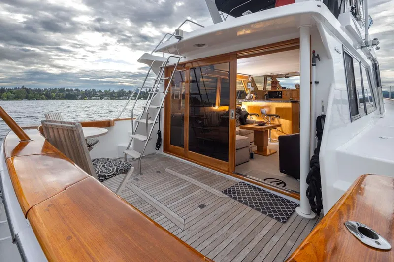  Yacht Photos Pics 1989 Ocean Alexander 50 Sedan yacht with wooden deck and open cabin view.