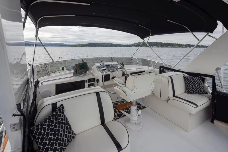  Yacht Photos Pics 1989 Ocean Alexander 50 Sedan yacht interior with elegant seating and scenic water view.