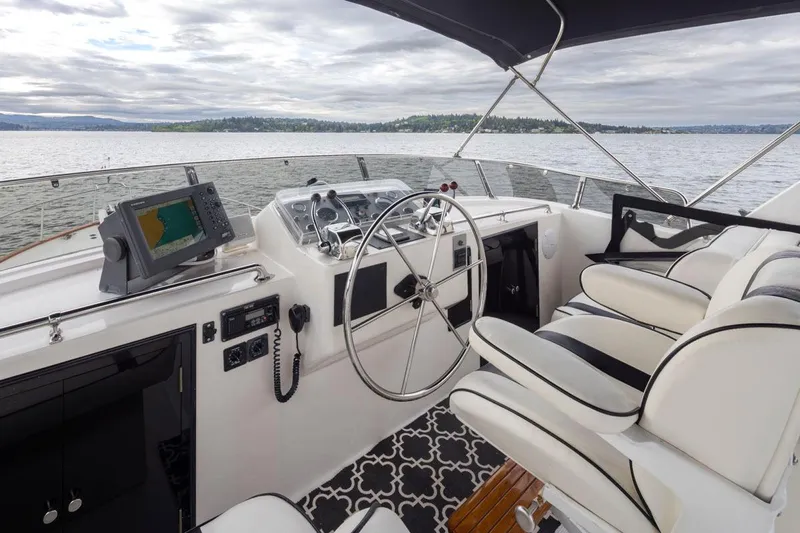  Yacht Photos Pics Cockpit of 1989 Ocean Alexander 50 Sedan yacht with steering wheel and navigation equipment.