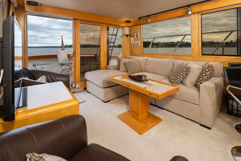  Yacht Photos Pics Luxurious interior of 1989 Ocean Alexander 50 Sedan yacht with comfortable seating and scenic views.