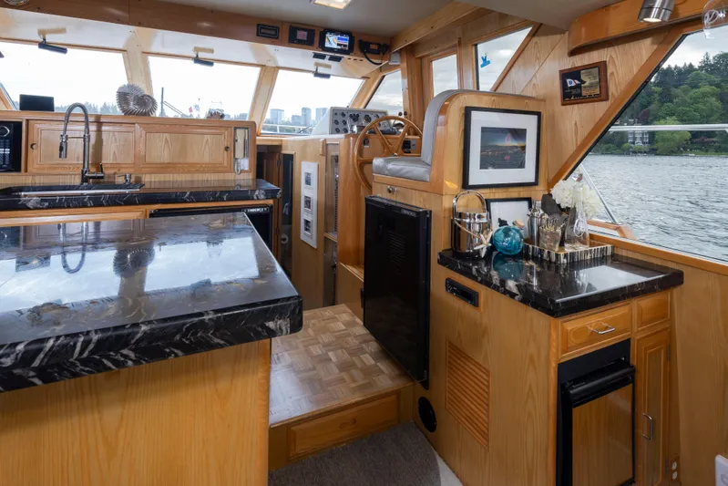  Yacht Photos Pics Interior of 1989 Ocean Alexander 50 Sedan yacht with wood and marble finishes.