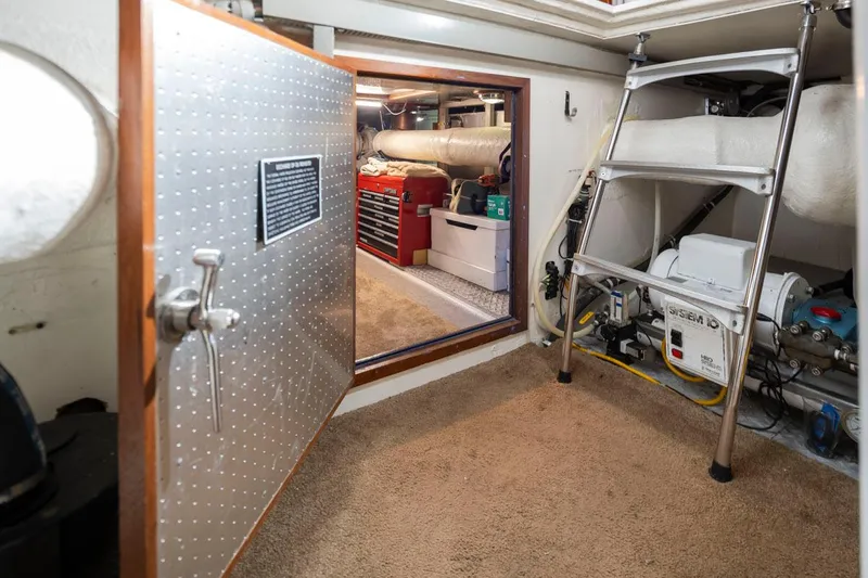  Yacht Photos Pics Engine room of 1989 Ocean Alexander 50 Sedan with tools and equipment.