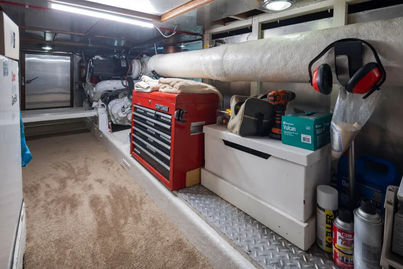  Yacht Photos Pics Engine room of 1989 Ocean Alexander 50 Sedan with tools and equipment neatly organized.