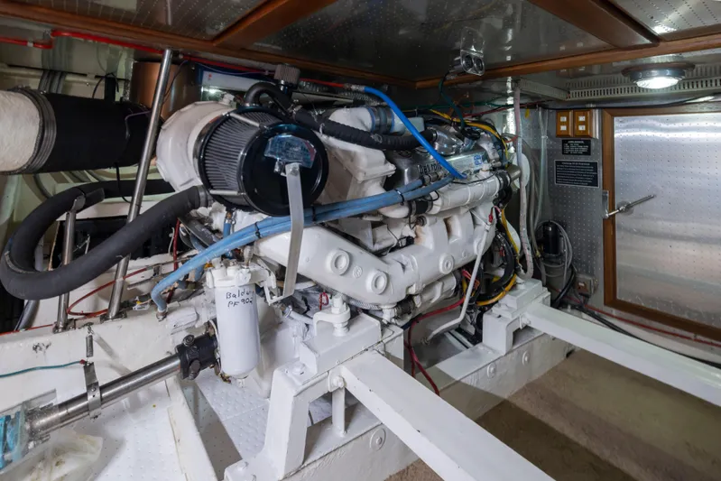  Yacht Photos Pics Engine room of 1989 Ocean Alexander 50 Sedan yacht, showcasing detailed mechanical components.