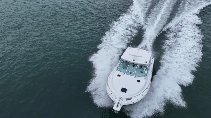  Yacht Photos Pics 2011 Rampage 34 IPS boat cruising on open water, aerial view.