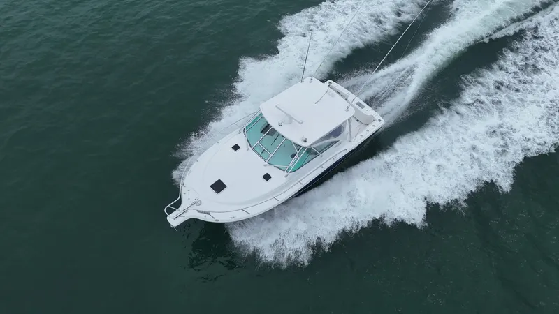  Yacht Photos Pics 2011 Rampage 34 IPS boat cruising on open water, aerial view.