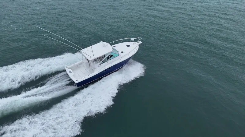  Yacht Photos Pics 2011 Rampage 34 IPS boat cruising on open water.