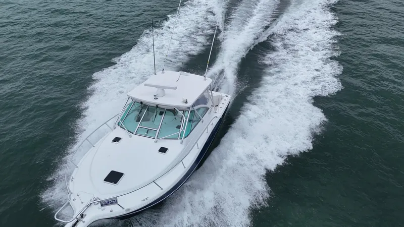  Yacht Photos Pics 2011 Rampage 34 IPS boat cruising on open water, leaving a wake behind.