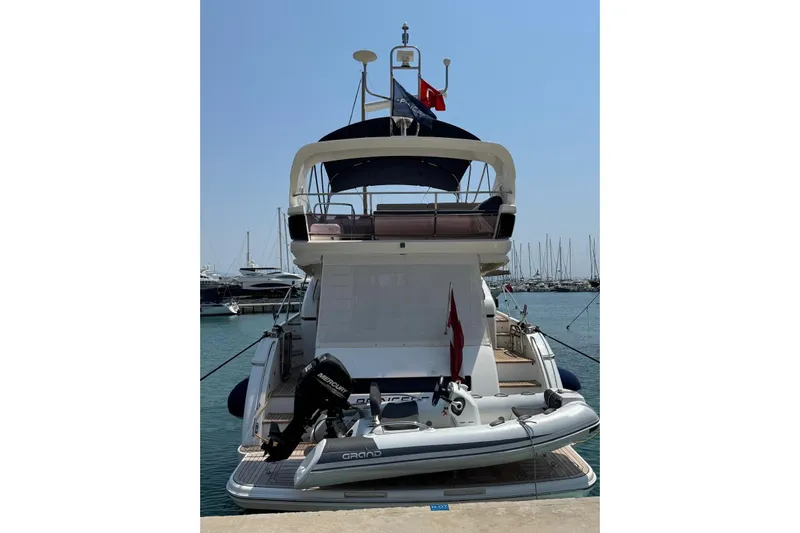  Yacht Photos Pics Luxury Princess 60 yacht from 2012 docked at a marina with inflatable boat.