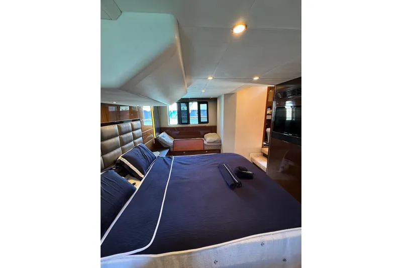  Yacht Photos Pics Luxurious bedroom interior of 2012 Princess 60 yacht with elegant bedding and modern design.