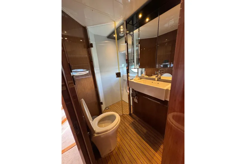  Yacht Photos Pics Luxurious bathroom in 2012 Princess 60 yacht with wooden flooring and modern fixtures.