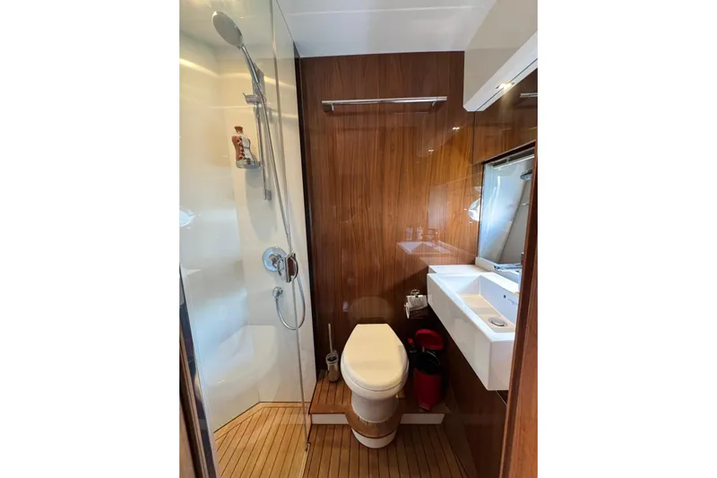  Yacht Photos Pics Luxurious bathroom in 2012 Princess 60 yacht with shower, toilet, and sink.