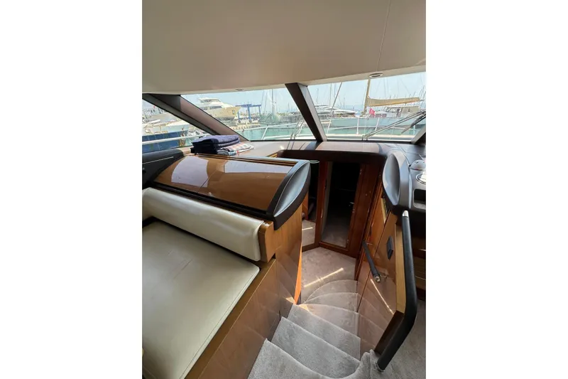  Yacht Photos Pics Luxurious interior of a 2012 Princess 60 yacht with elegant wood and leather finishes.