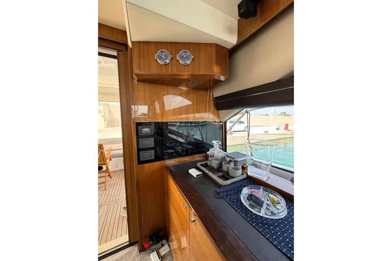  Yacht Photos Pics Luxurious interior of 2012 Princess 60 yacht with elegant wood finish and modern amenities.