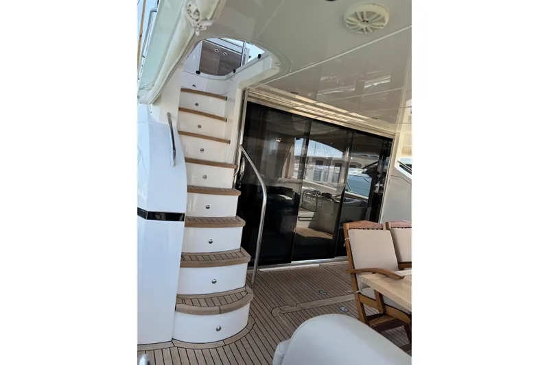  Yacht Photos Pics Luxurious 2012 Princess 60 yacht interior with elegant staircase and seating area.