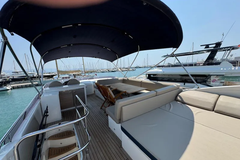  Yacht Photos Pics Luxurious 2012 Princess 60 yacht with spacious deck and seating area in marina.