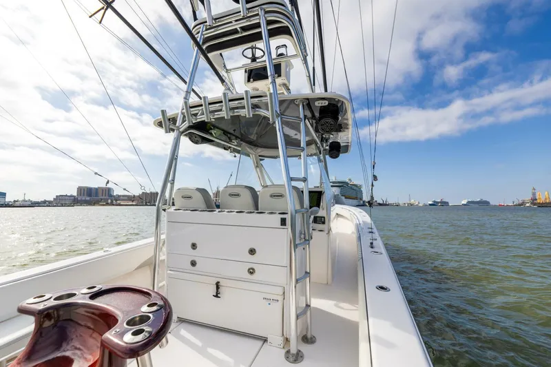 Fools Gold Yacht Photos Pics 2017 Contender 39 Fish Around boat on water, featuring spacious deck and fishing equipment.