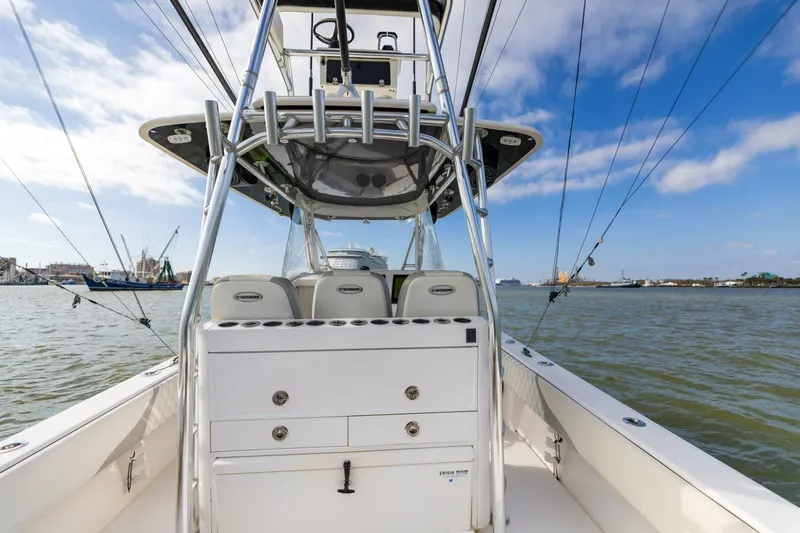 Fools Gold Yacht Photos Pics 2017 Contender 39 Fish Around boat on water, featuring fishing rod holders and storage.