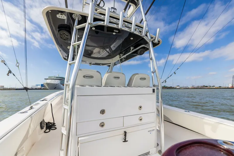 Fools Gold Yacht Photos Pics 2017 Contender 39 Fish Around boat interior with seating and storage, on calm water.