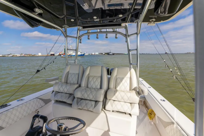 Fools Gold Yacht Photos Pics 2017 Contender 39 Fish Around boat interior with plush seating and fishing rods.