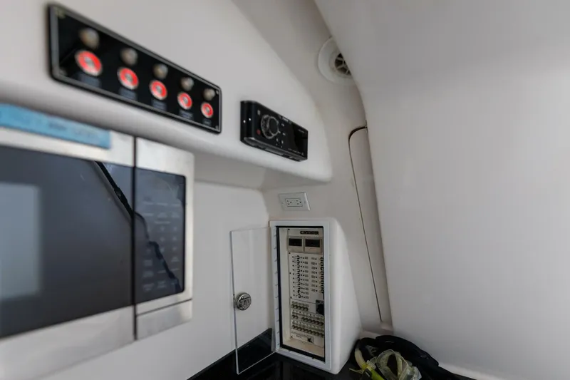 Fools Gold Yacht Photos Pics Control panel inside 2017 Contender 39 Fish Around boat, featuring switches and electronic equipment.