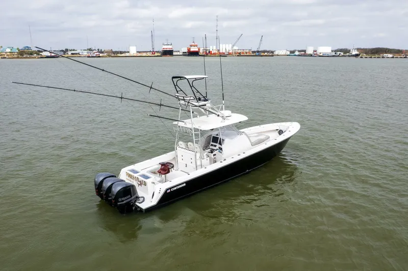 Fools Gold Yacht Photos Pics 2017 Contender 39 Fish Around boat on calm water, equipped with dual outboard motors.