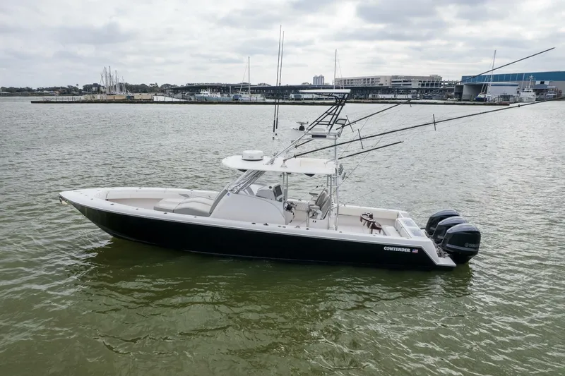 Fools Gold Yacht Photos Pics 2017 Contender 39 Fish Around boat on calm water with fishing rods.