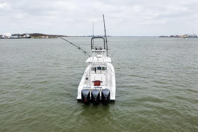 Fools Gold Yacht Photos Pics 2017 Contender 39 Fish Around boat on open water, equipped with multiple outboard engines.