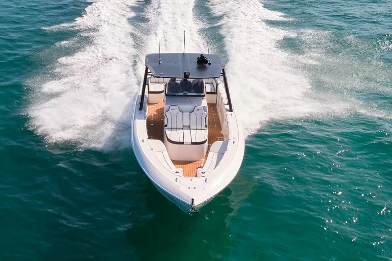  Yacht Photos Pics 2020 Midnight Express 37' Open boat cruising on clear blue water.