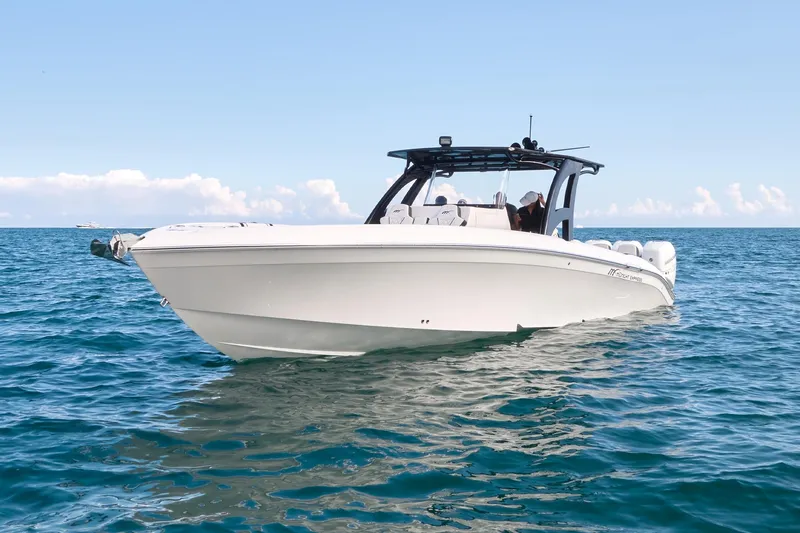  Yacht Photos Pics 2020 Midnight Express 37' Open boat on calm ocean waters.