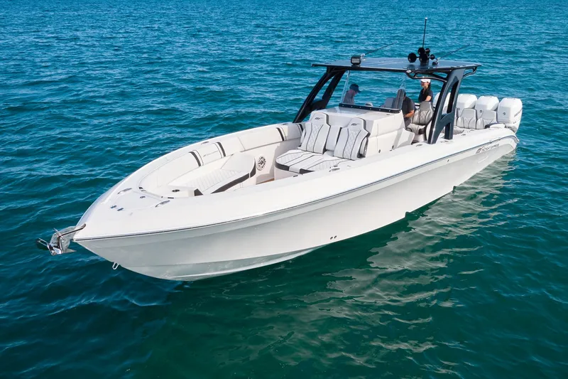  Yacht Photos Pics 2020 Midnight Express 37' Open boat cruising on clear blue water.