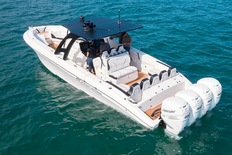  Yacht Photos Pics 2020 Midnight Express 37' Open boat with triple Mercury outboard engines on the water.