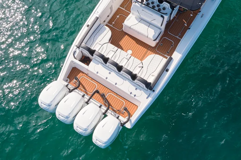  Yacht Photos Pics 2020 Midnight Express 37' Open boat with four outboard engines on the water.