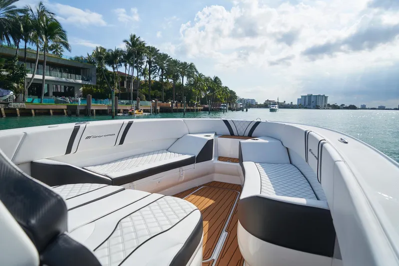  Yacht Photos Pics 2020 Midnight Express 37' Open boat with luxurious seating on a sunny waterfront.