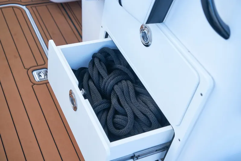  Yacht Photos Pics Open drawer with black rope on a 2020 Midnight Express 37' Open boat.