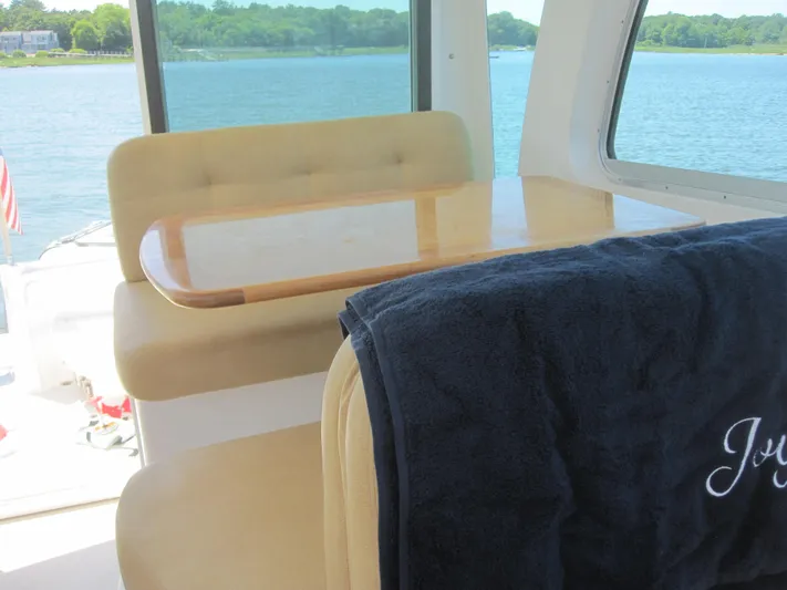  Yacht Photos Pics Interior of 2014 Back Cove 34 Hard Top, featuring seating and table with lake view.