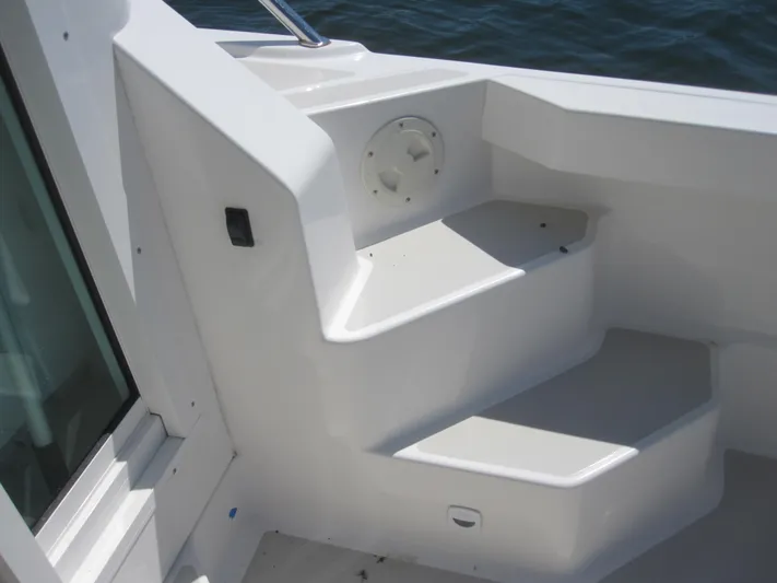  Yacht Photos Pics 2014 Back Cove 34 Hard Top boat interior steps, white finish, near water.
