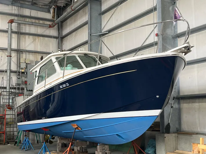  Yacht Photos Pics 2014 Back Cove 34 Hard Top/Hard Back boat in indoor storage on stands.